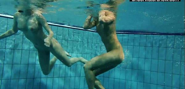  Two sexy amateurs showing their bodies off under water